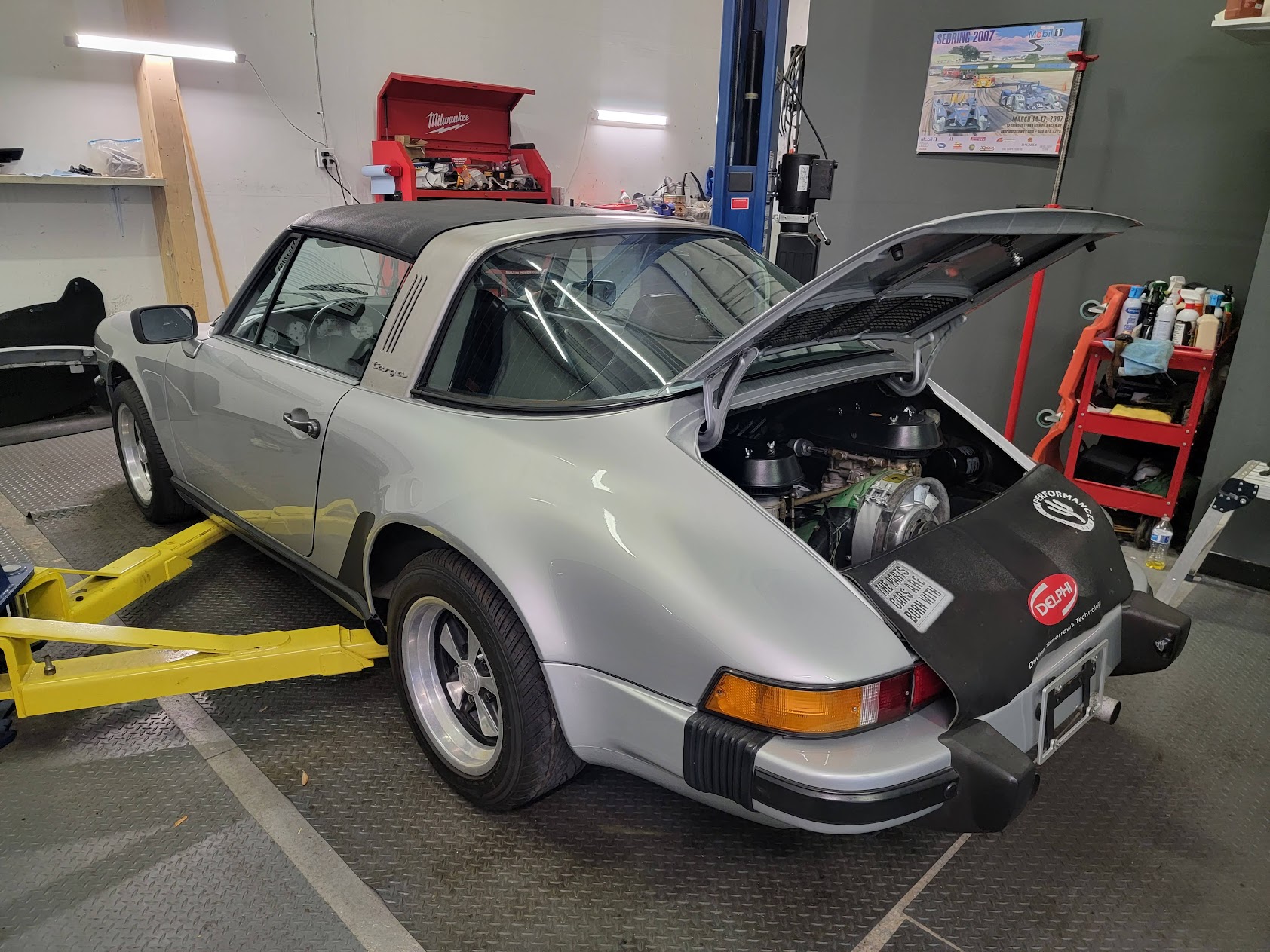 Paint thickness gauge on a black hood