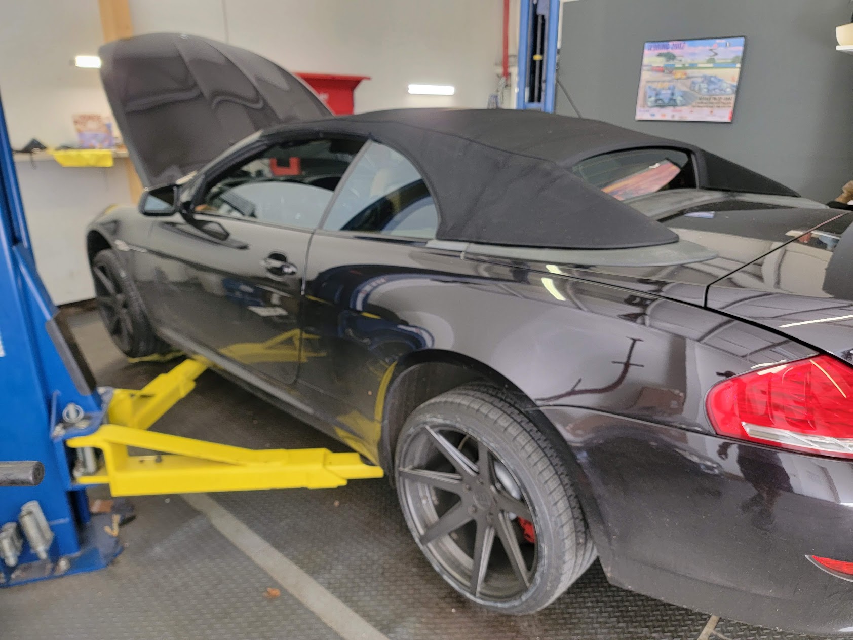 Paint thickness gauge on a white hood