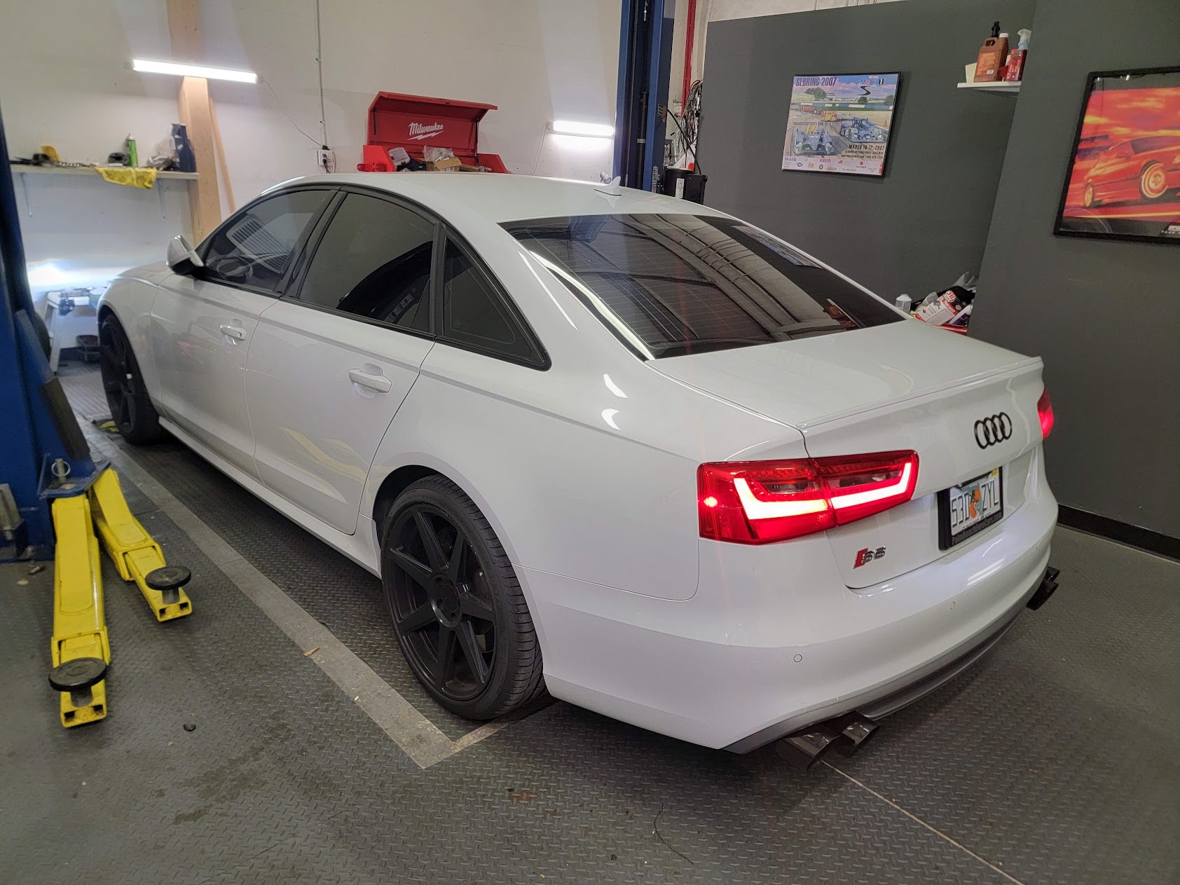 White Audi sedan in the inspection bay