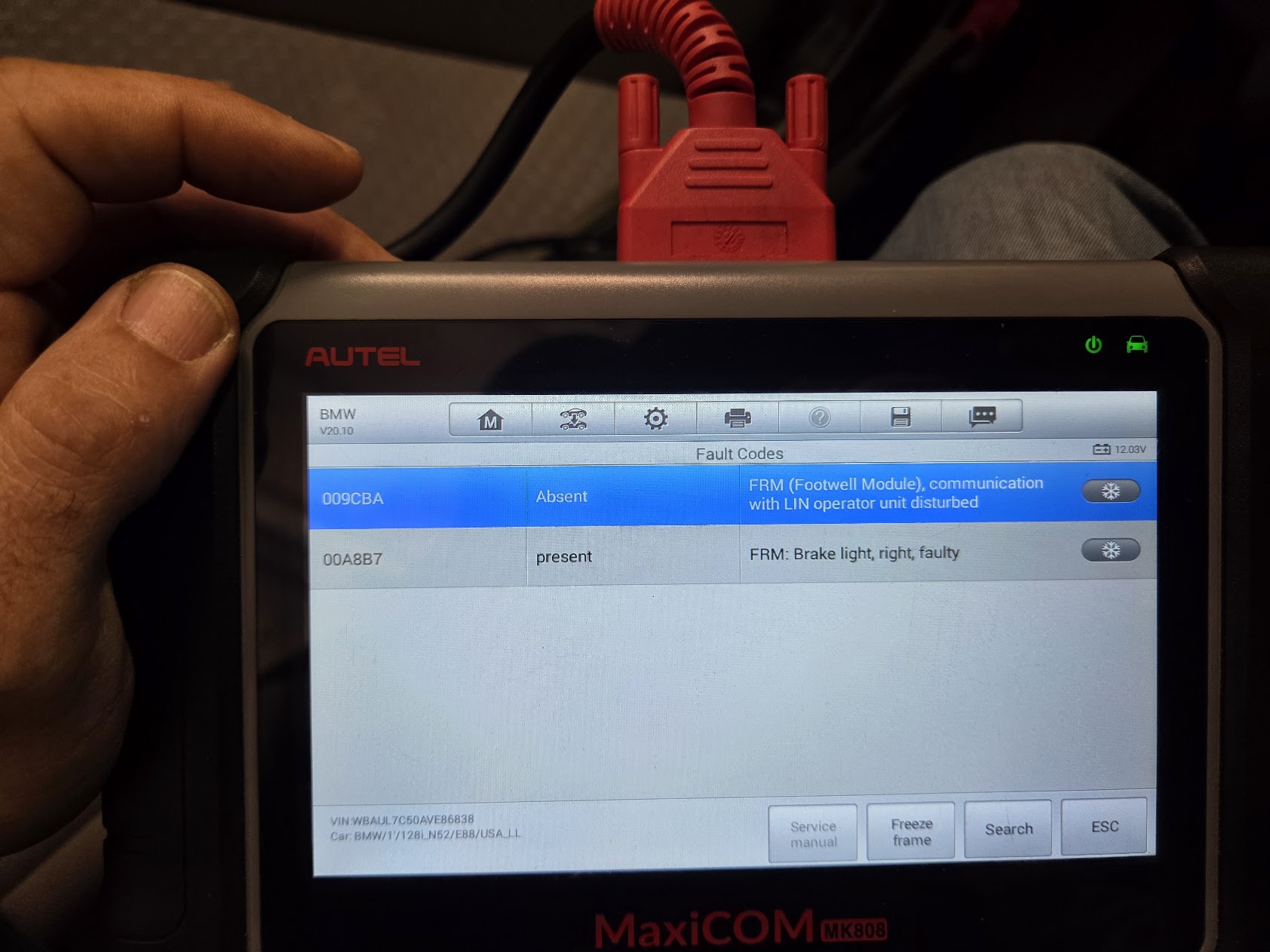 Diagnostic scan tool showing BMW fault codes